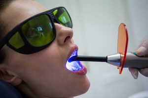 <a href="https://www.freepik.com/free-photo/dentist-examining-patients-teeth-with-dental-curing-light_8896122.htm#query=laser%20gum%20treatment&position=1&from_view=search&track=ais">Image by wavebreakmedia_micro</a> on Freepik